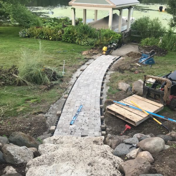Construction of hardscaped path through backyard